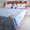 "Soft blue bedsheet for a peaceful, comfortable bedroom"